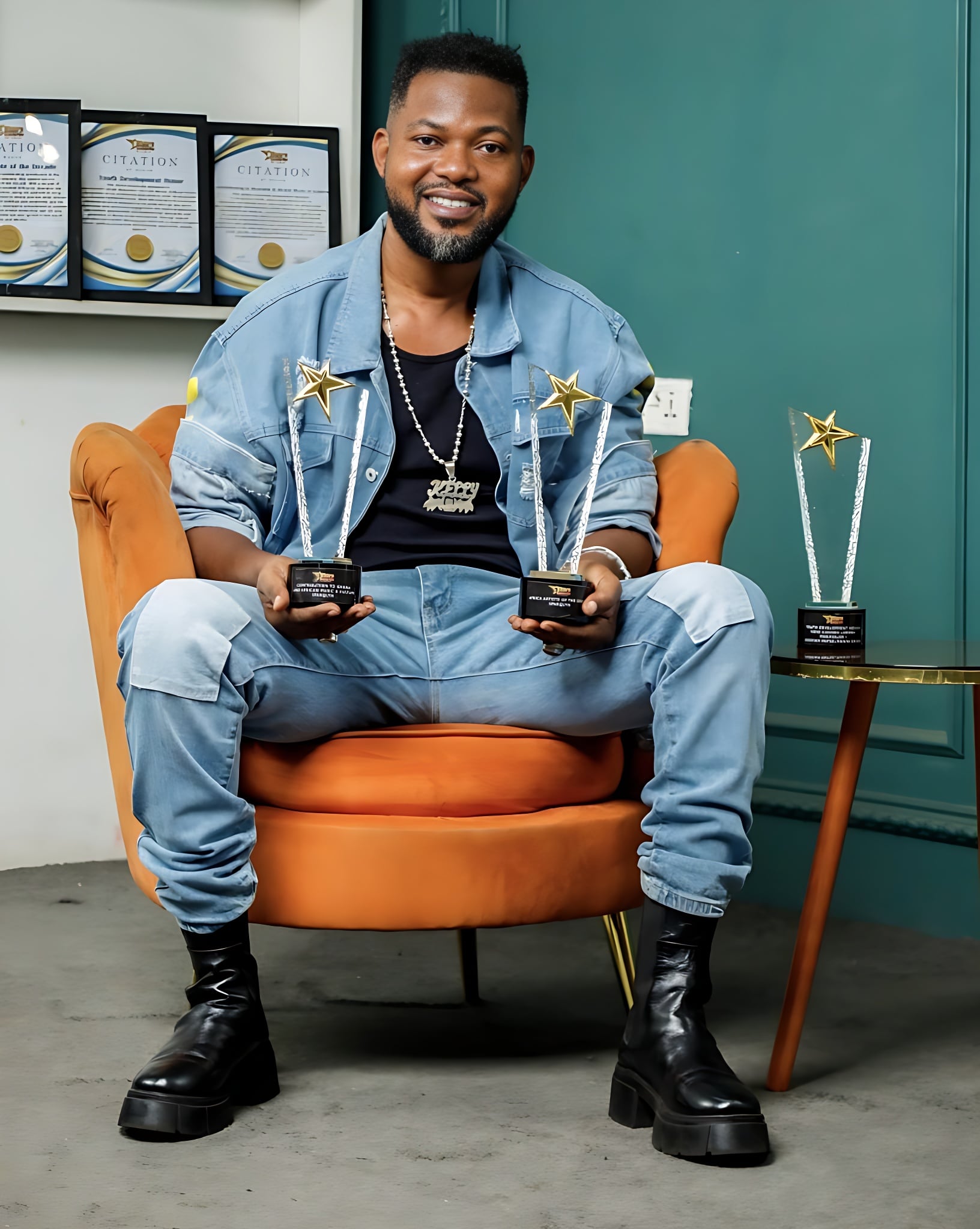 Sparqlyn with three Stars Awards trophies